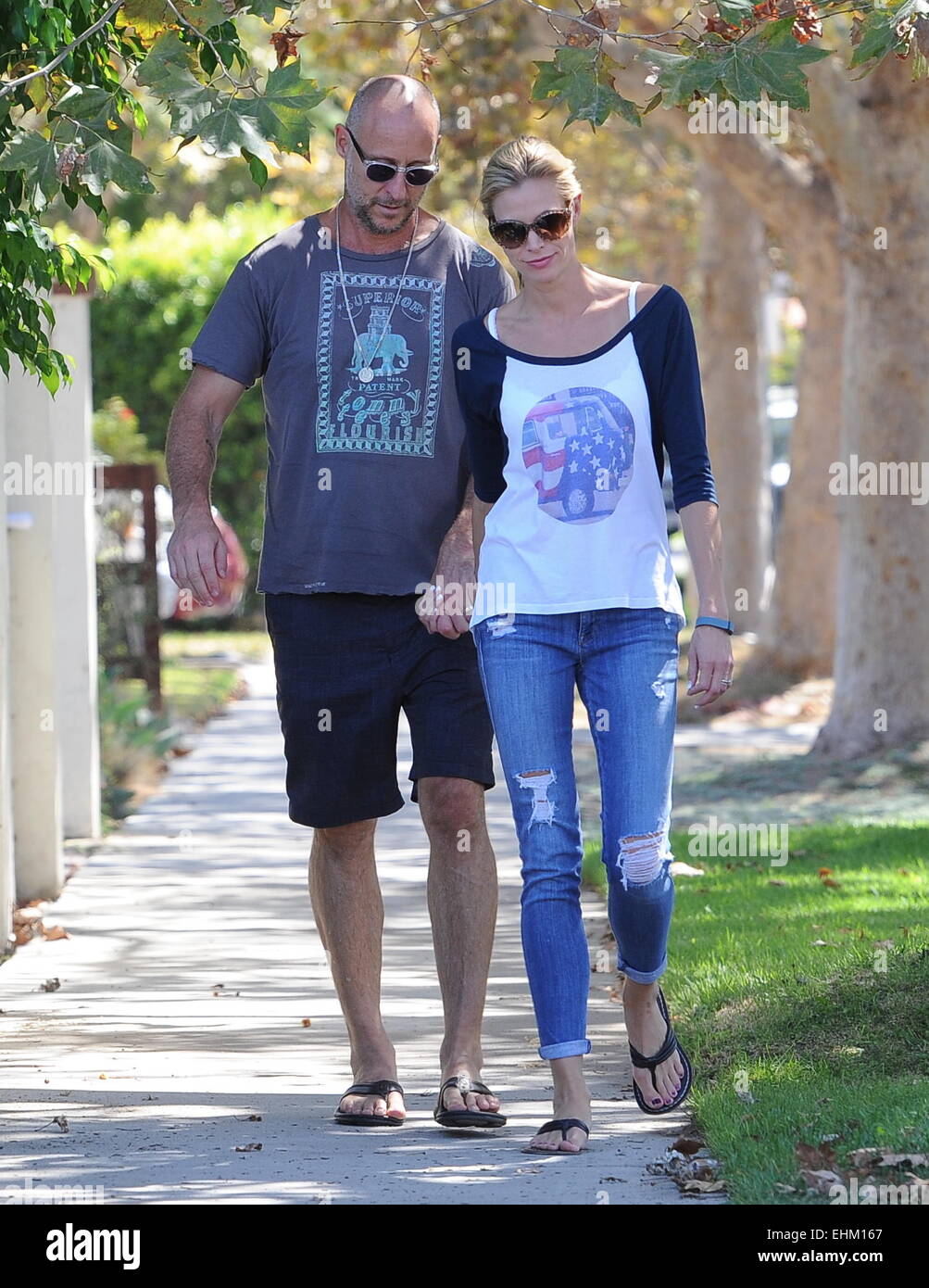 Actress Brooke Burns holds on tight to fiance Gavin O'Connor as the ...