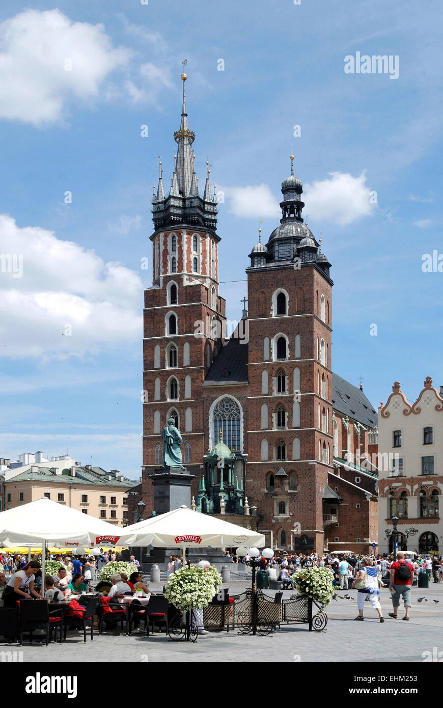 Street Cafe with tourists in front of the St. Mary's Church on the Main market of Krakow in Poland.   Achtung: Nur zur redaktion Stock Photo