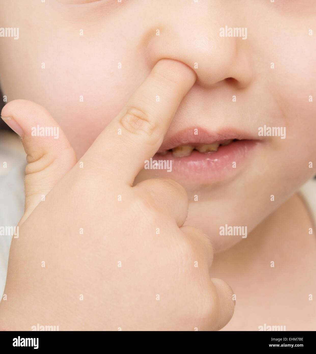 finger in nose Stock Photo