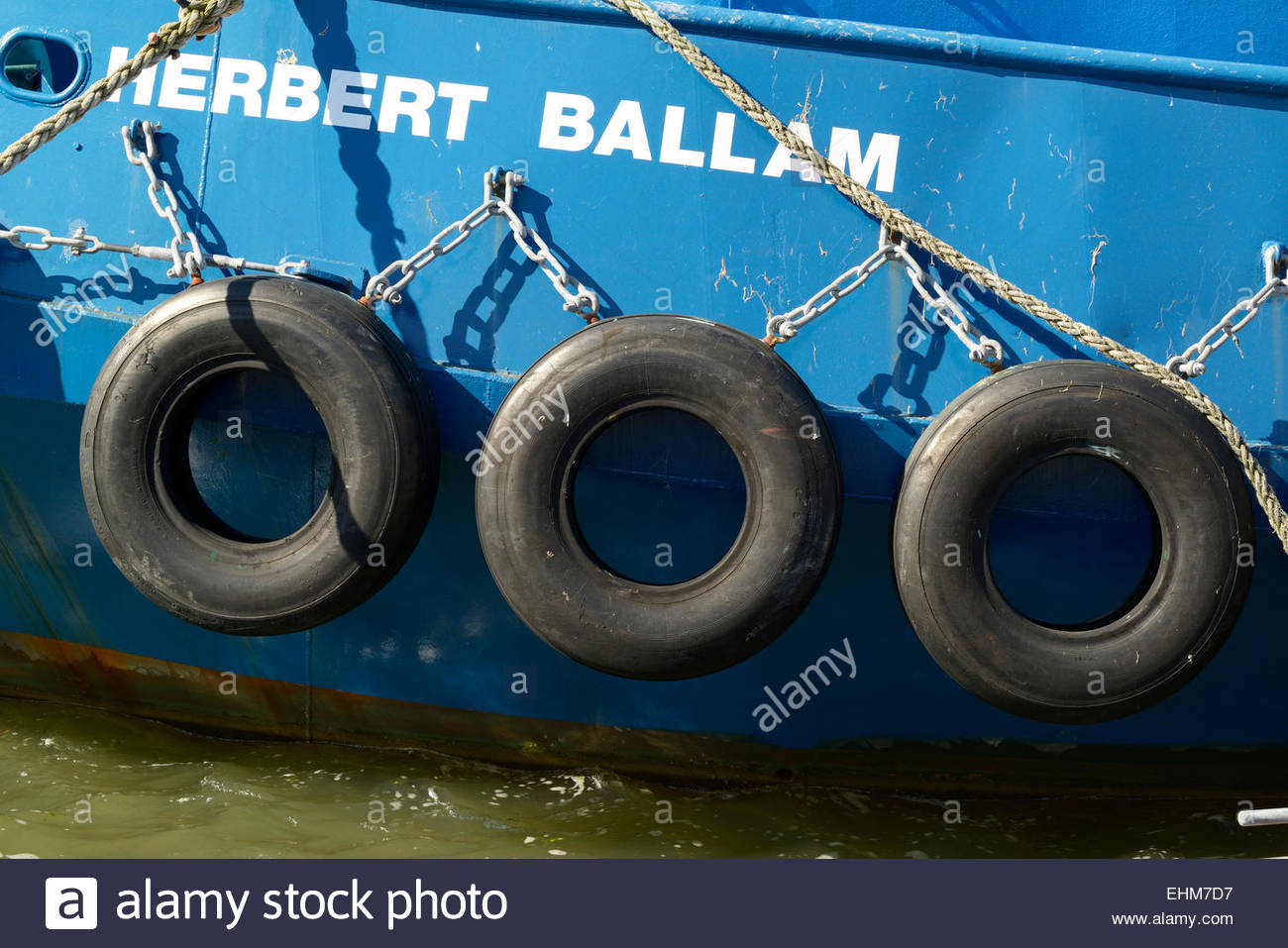Old car tyres used as boat fenders, Poole harbour, Dorset ...