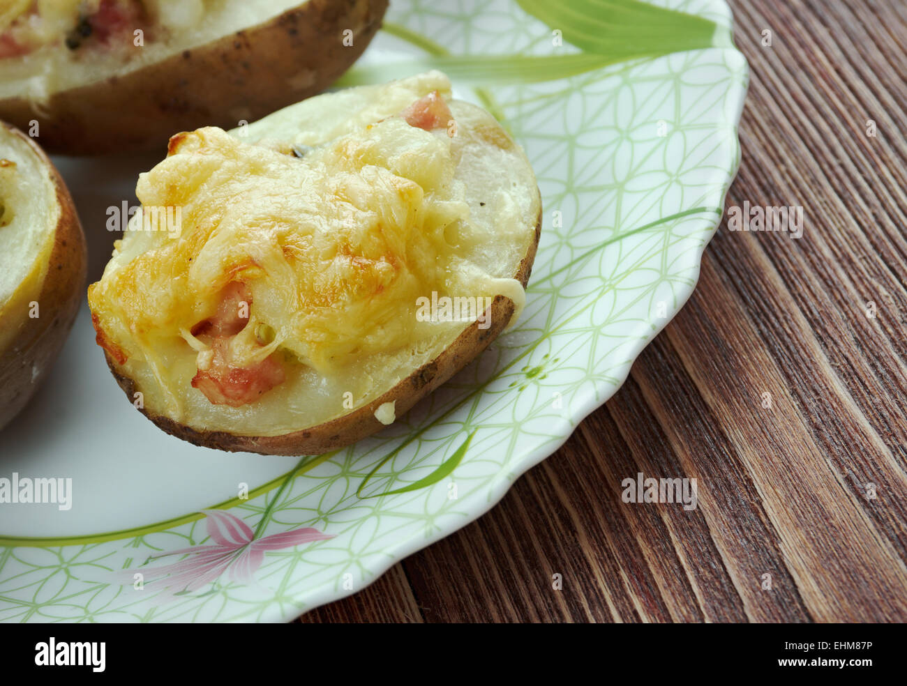 Stuffed Baked Potatoes with ham and cheddar cheese Stock Photo