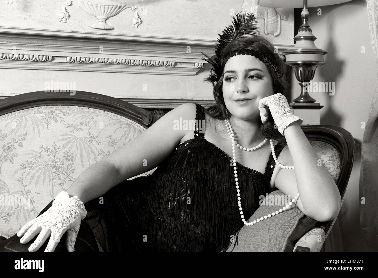 A portrait of a woman dressed in vintage 1920's flapper style clothing (Black and White) Stock Photo