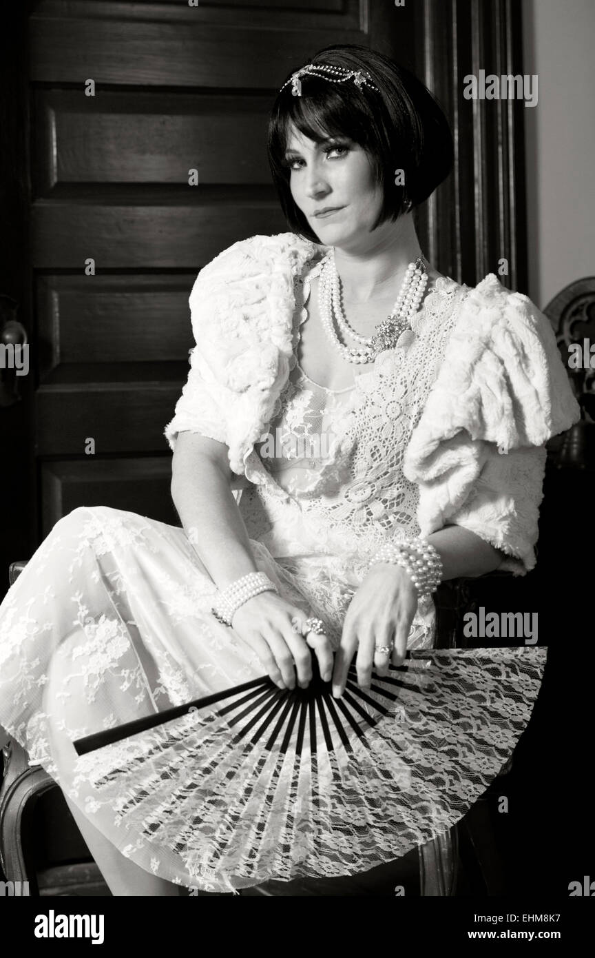 A portrait of a woman dressed in vintage style clothing (twenties thirties). Black and white photo Stock Photo