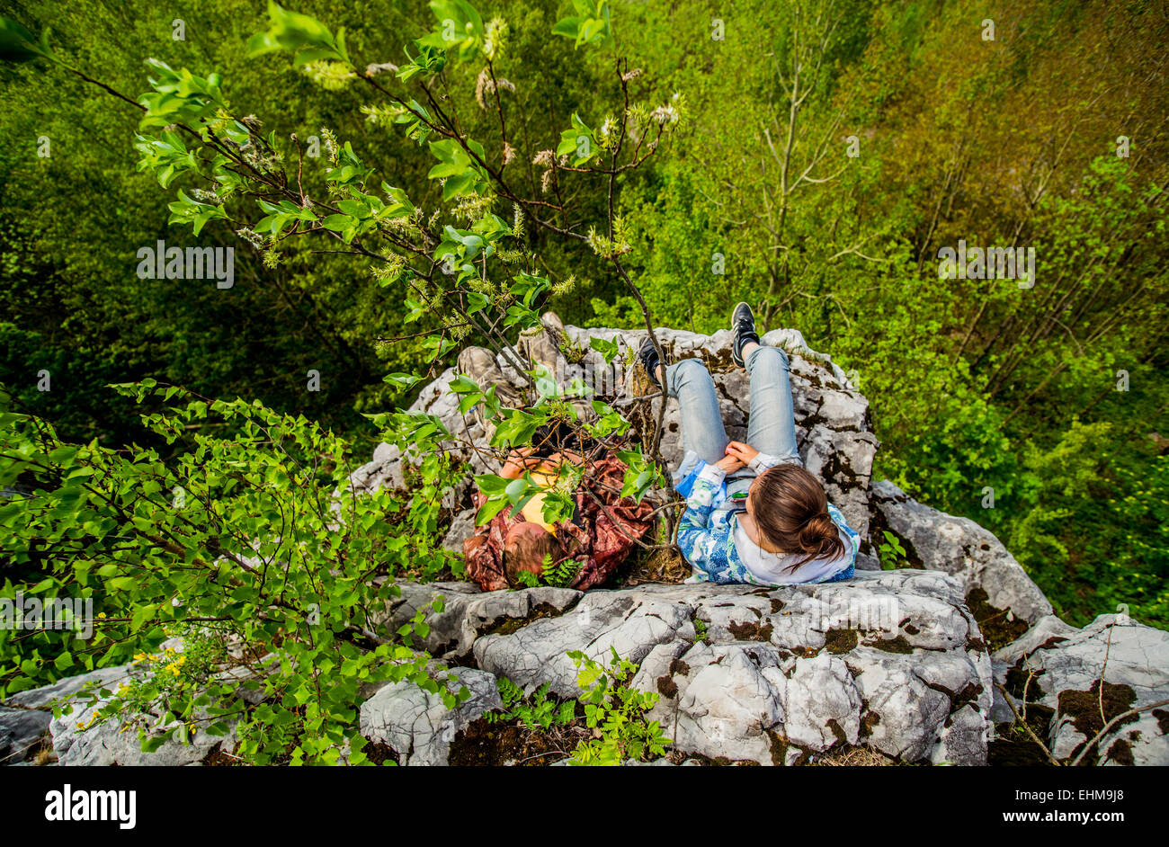 Girl sitting on edge cliff hi-res stock photography and images - Alamy