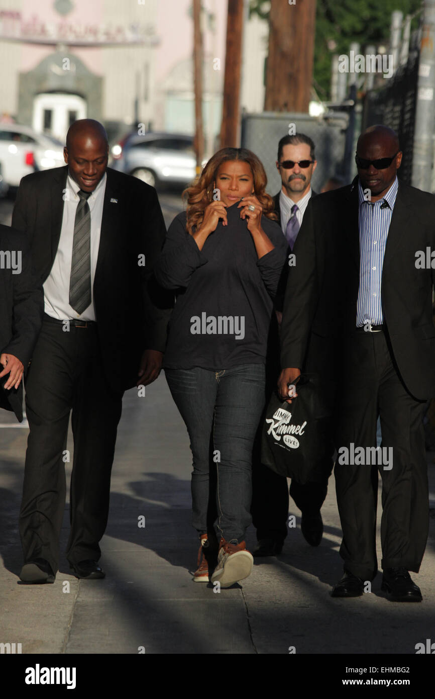 Queen Latifah covers her nose with her sweater as she arrives for her appearance on Jimmy Kimmel Live! Featuring: Queen Latifah Where: Los Angeles, California, United States When: 10 Sep 2014 Stock Photo