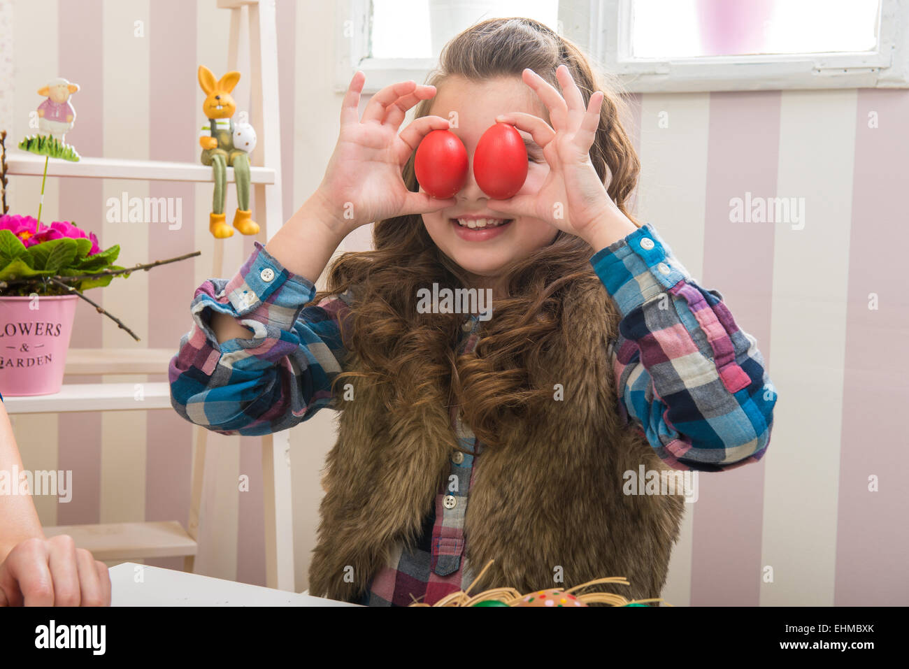 Easter - Mother and daughter funny eyes than eggs Stock Photo