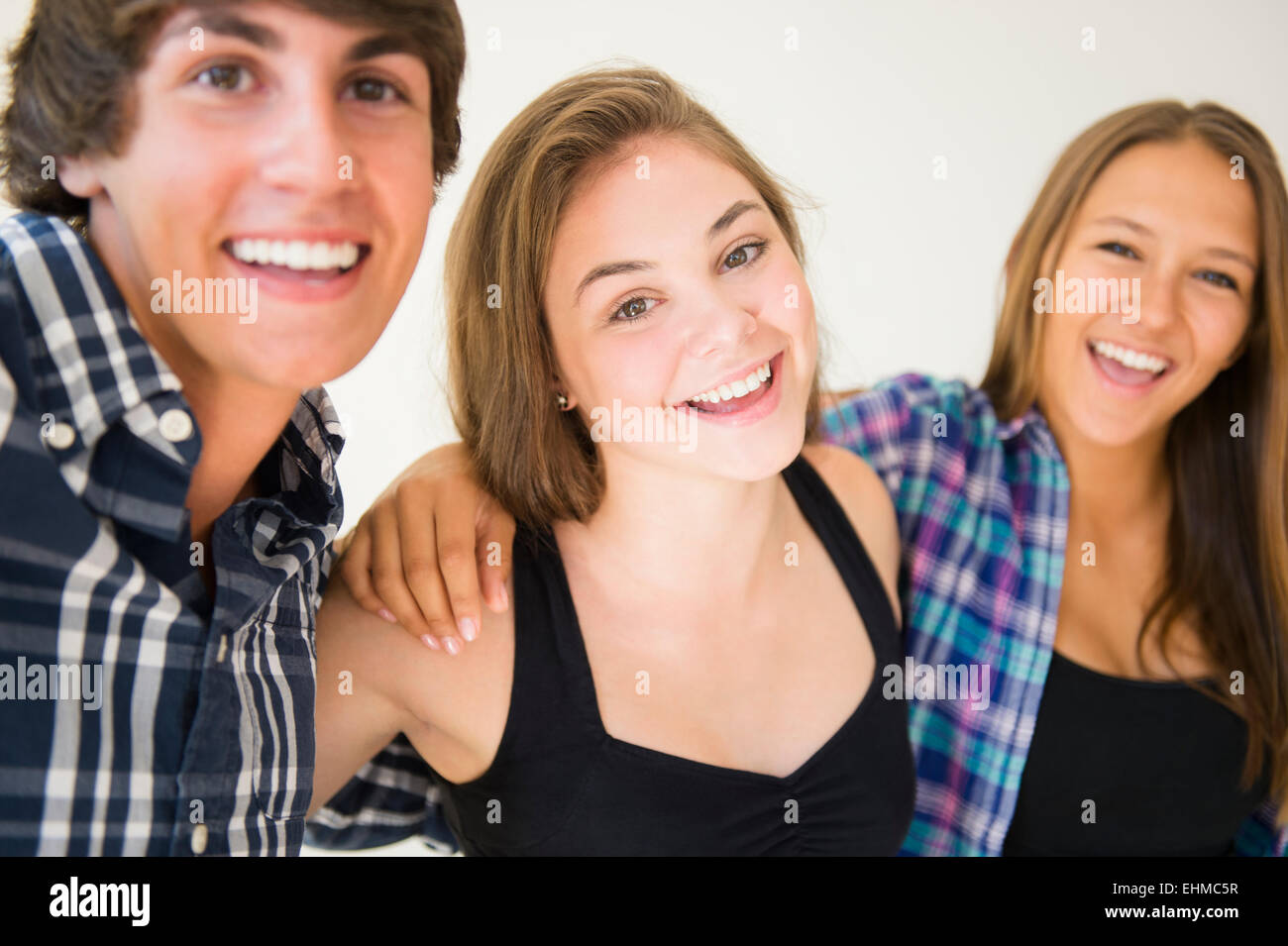 Teenagers hugging and smiling Stock Photo