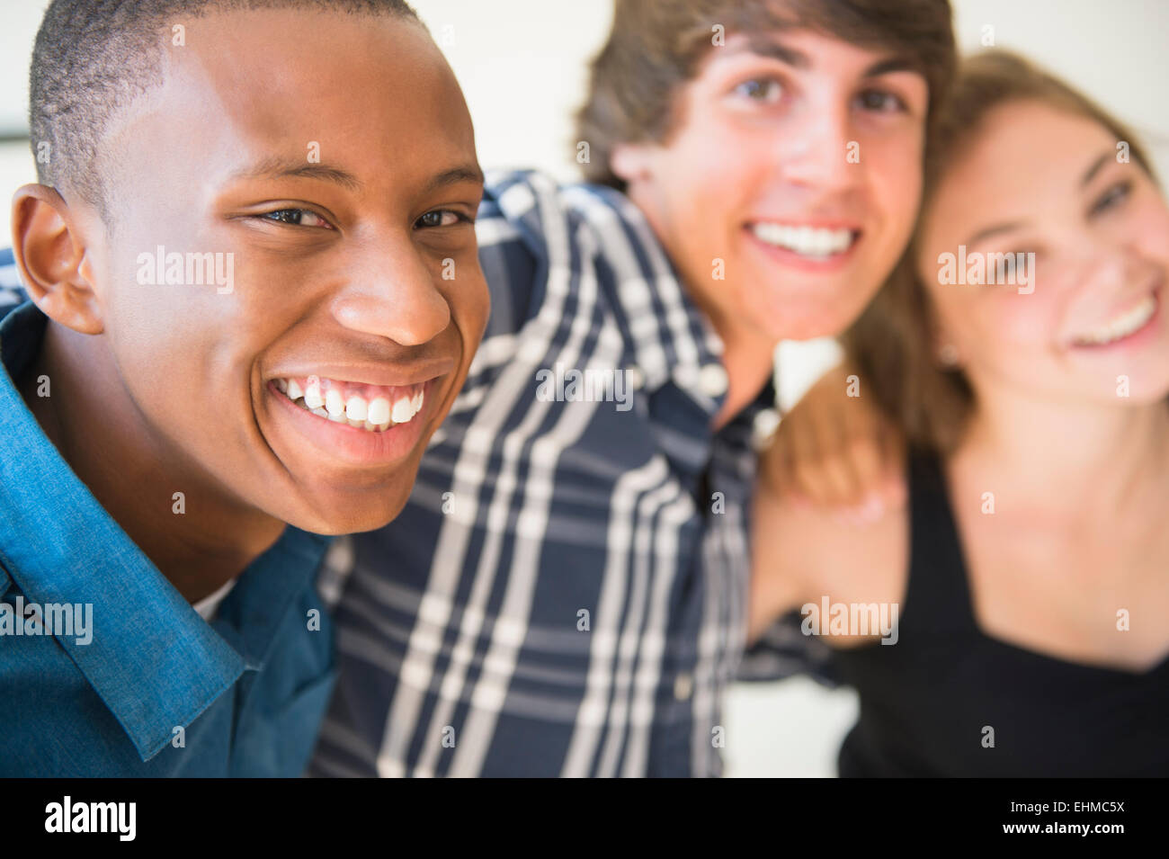 Teenagers hugging and smiling Stock Photo