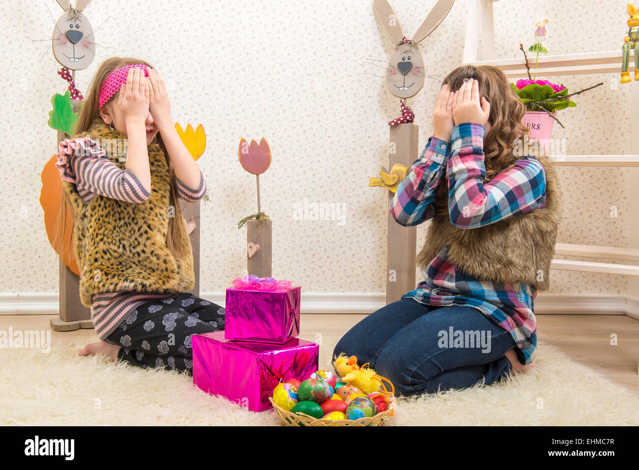 Easter - Two sisters, girlfriend surprised Easter gift Stock Photo