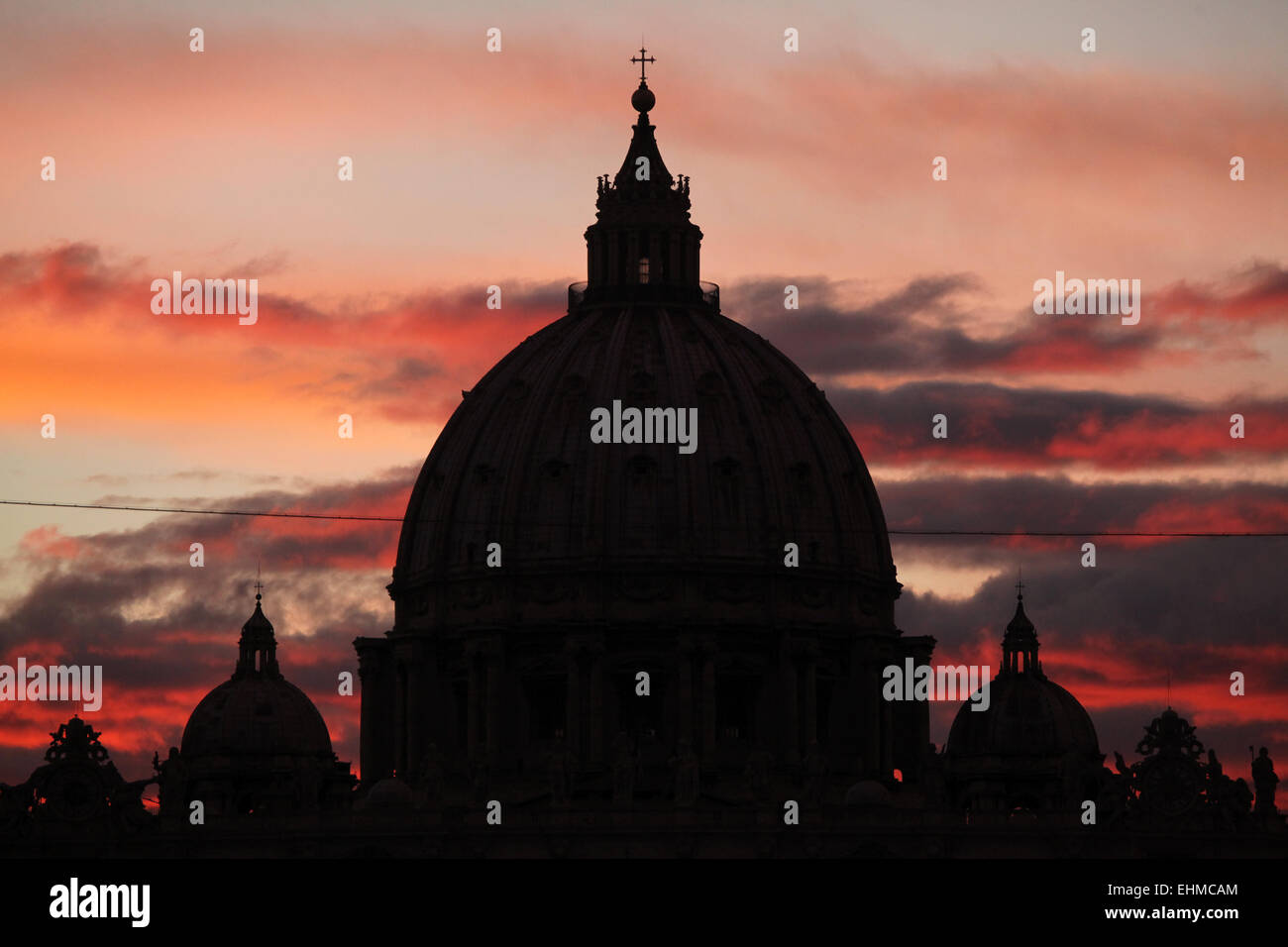 Sunset over the dome of Saint Peter's Basilica in Vatican City in Rome, Lazio, Italy. Stock Photo