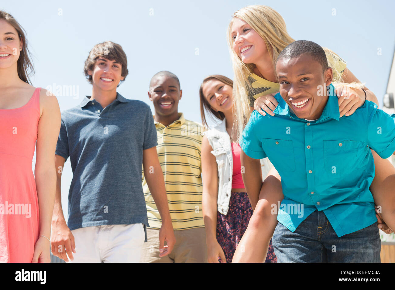 Teenagers standing together outdoors Stock Photo