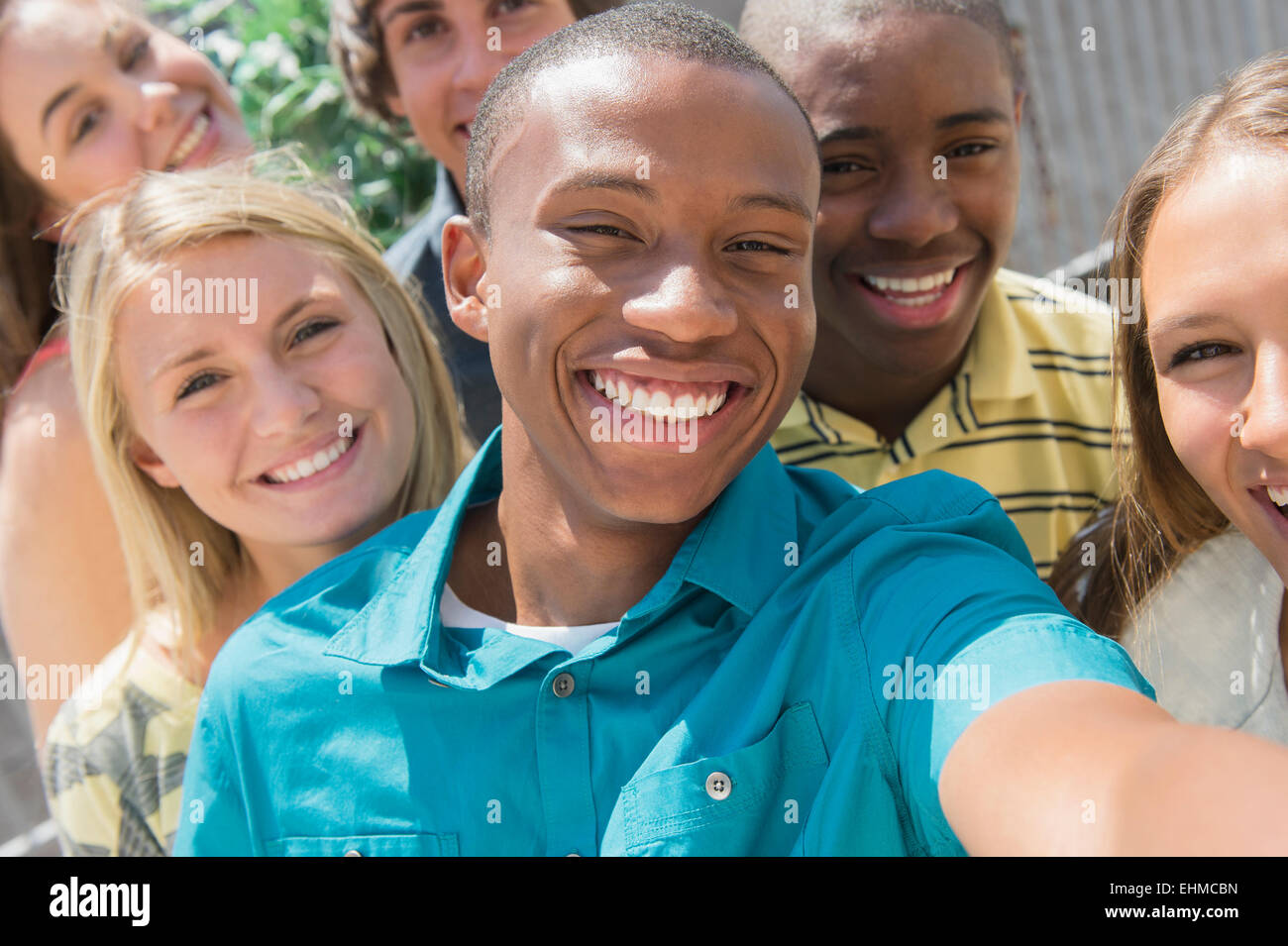 Teenagers taking selfie together outdoors Stock Photo