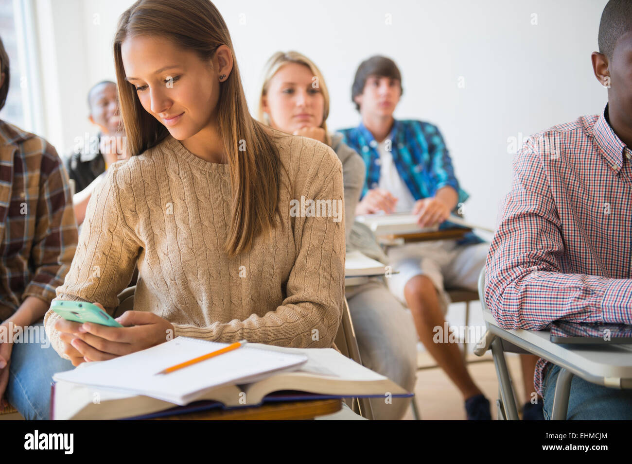Teenage girl texting classroom hi-res stock photography and images - Alamy