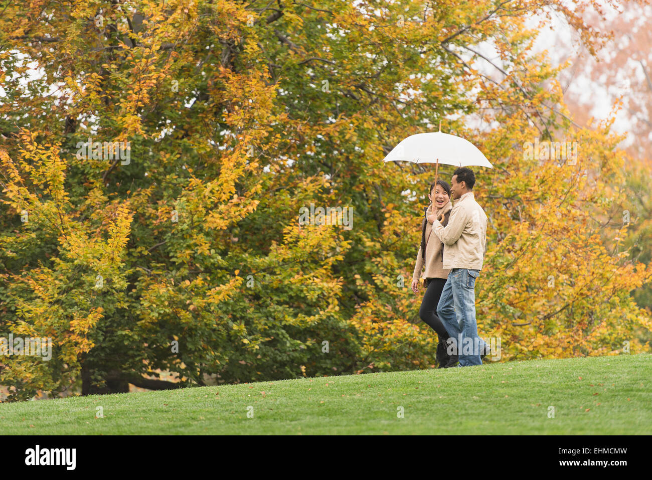Side view man walking umbrella hi-res stock photography and images - Alamy