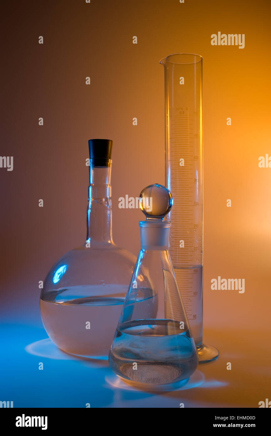 chemical glassware in multicolored lights Stock Photo