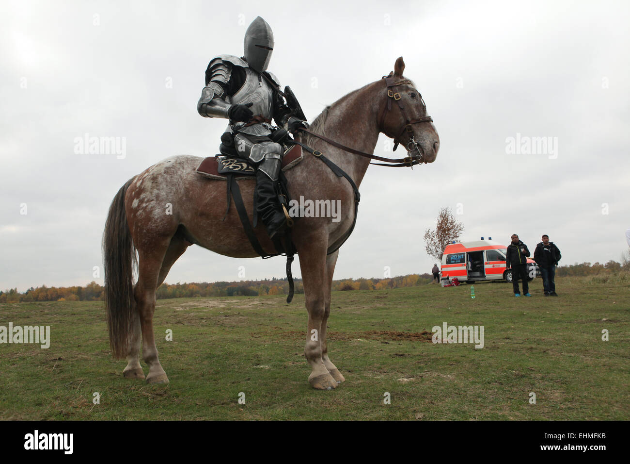 Actor dressed as a medieval knight rides a horse during the filming of the new German film 'Die Ritter' ('The Knights') directed by Carsten Gutschmidt by order of ZDF in Milovice in Central Bohemia, Czech Republic in 23 October 2013. Stock Photo
