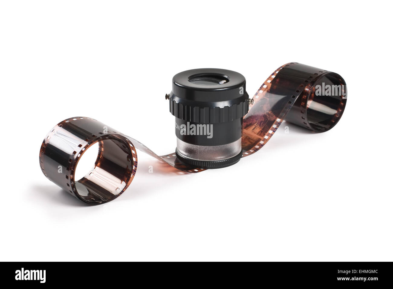 twisted negative film, and Magnifier isolated on white background Stock