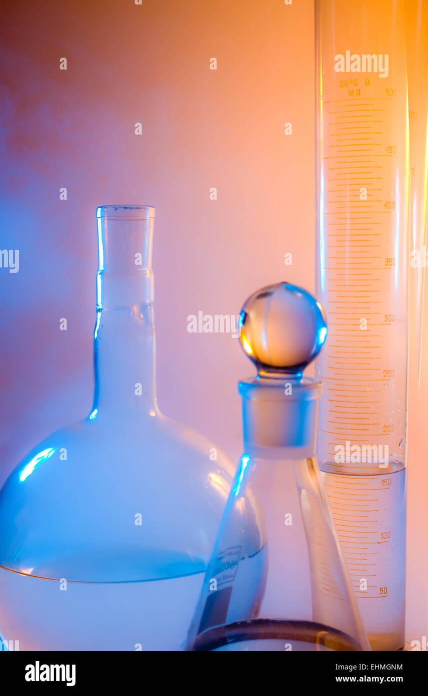 chemical glassware in multicolored lights Stock Photo