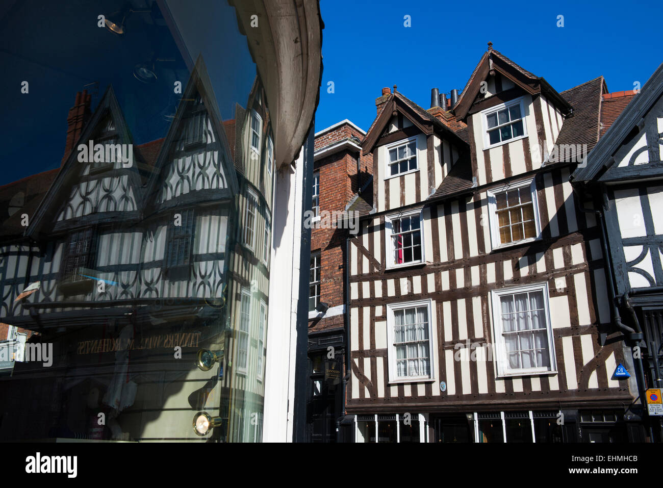 Timber-framed buildings on Wyle Cop reflected in a shop window, Shrewsbury, Shropshire. Stock Photo