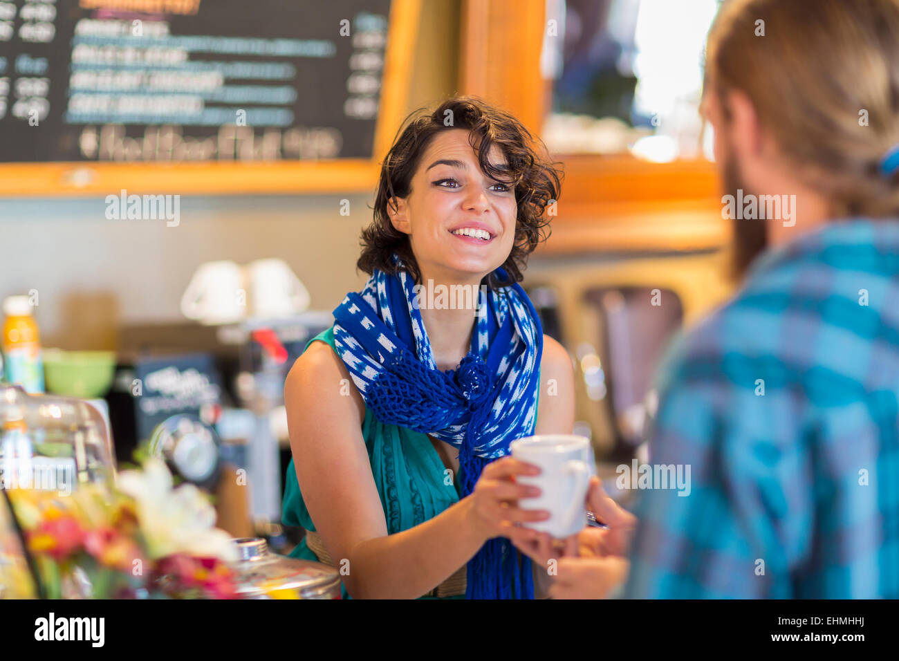 Server giving cup of coffee to customer in cafe Stock Photo Alamy