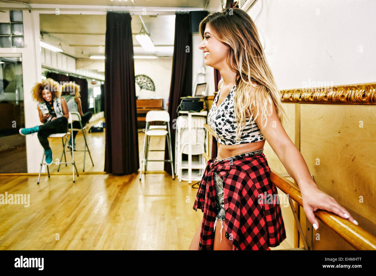 Dancer standing at bar in studio Stock Photo