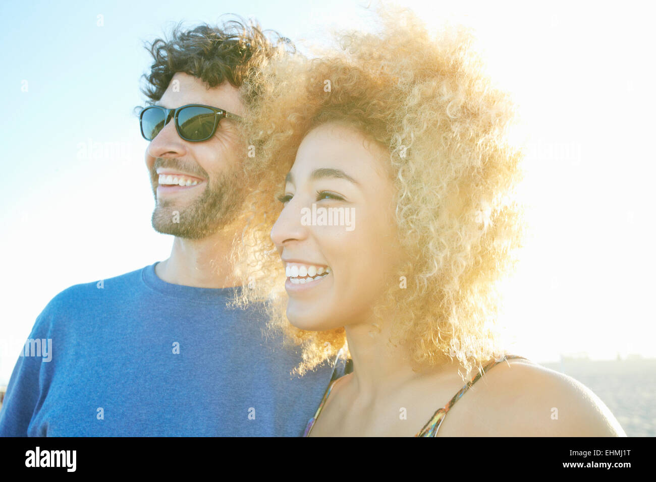 Smiling couple laughing outdoors Stock Photo