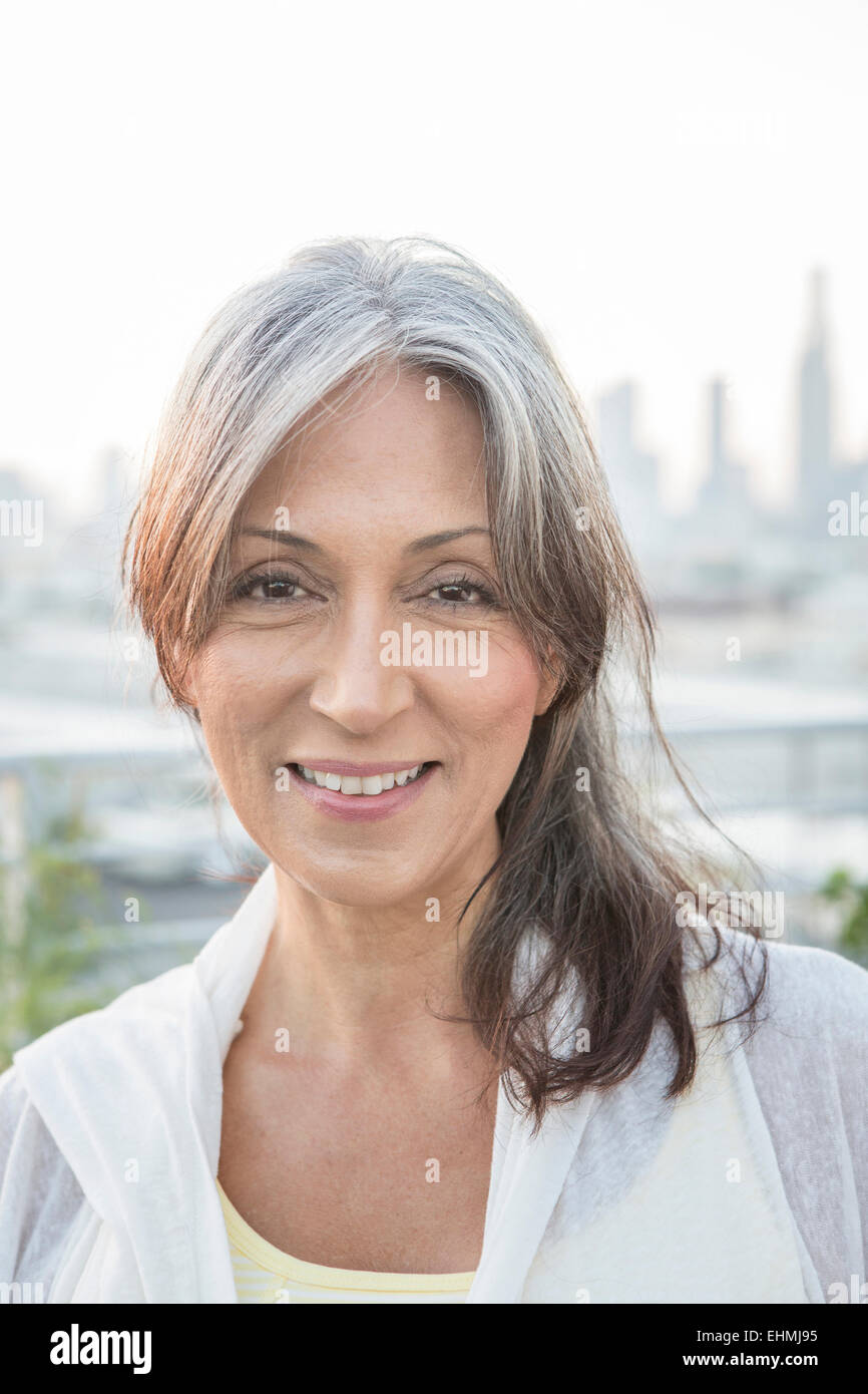 Older mixed race woman smiling Stock Photo