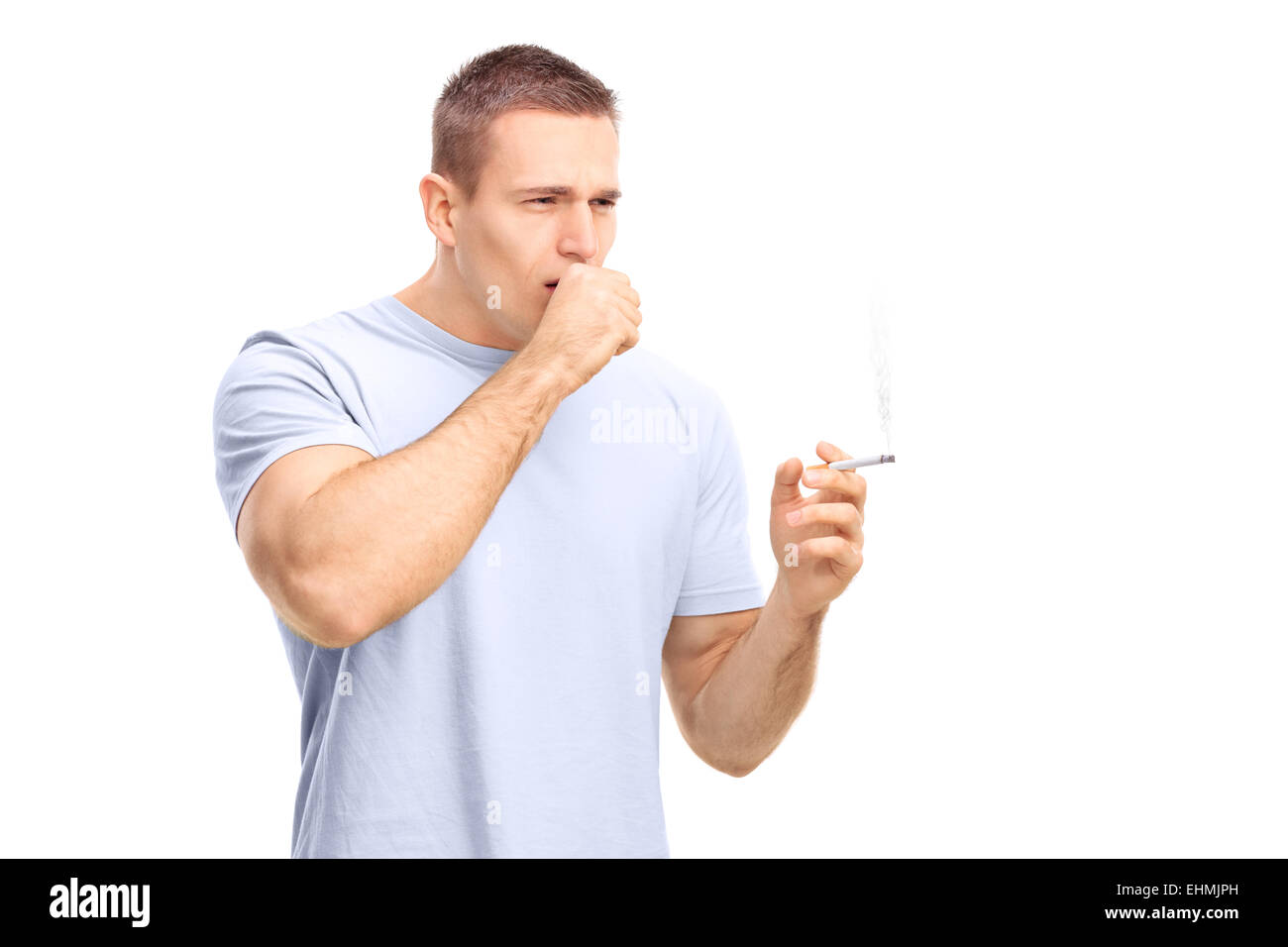 coughing and smoking cigarettes Young man smoking a cigarette and coughing isolated on white background  Stock Photo