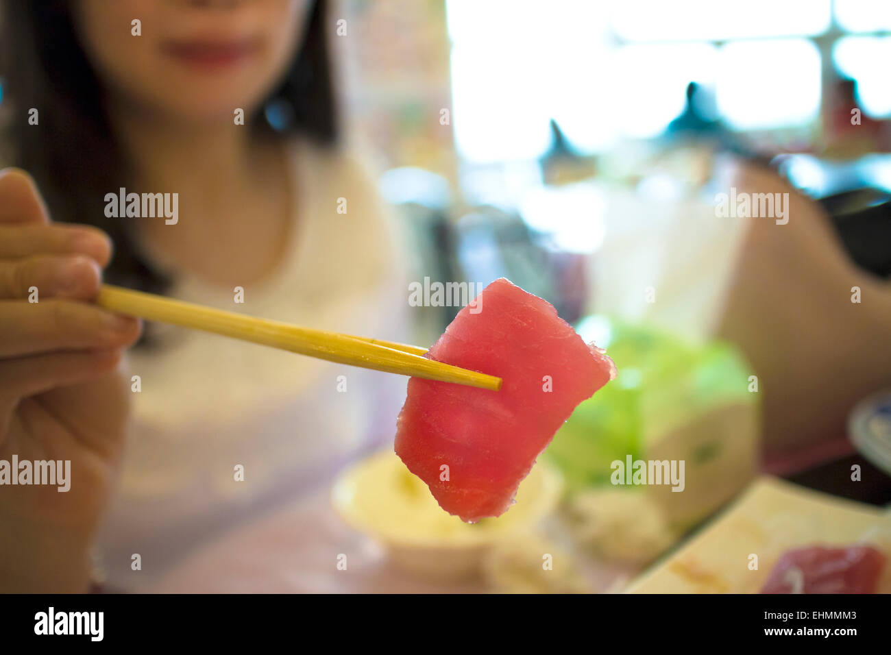 woman ready to eat sashimi in restaurant Stock Photo
