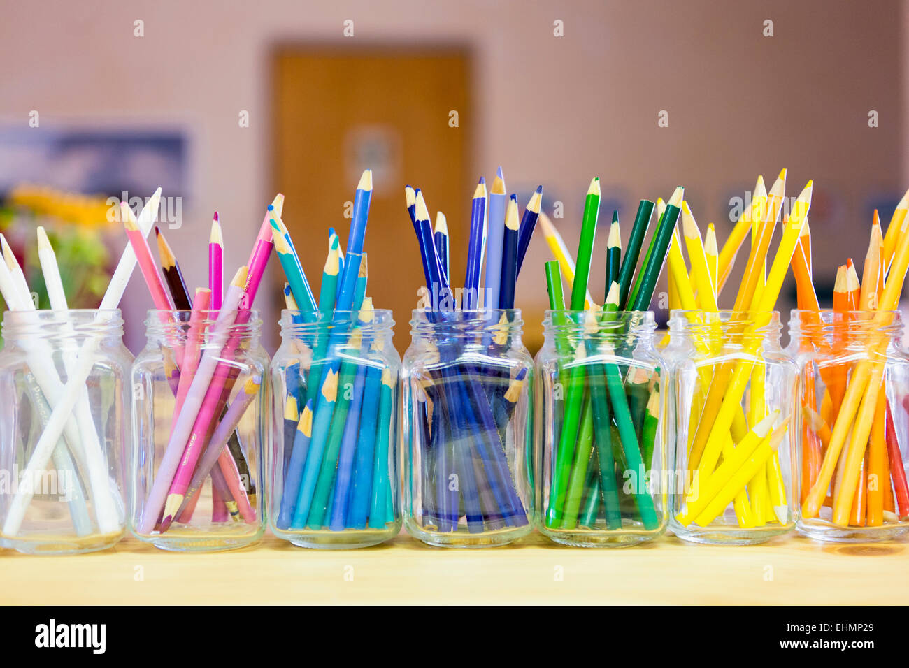 Close up of multicolor pencils organized in jars Stock Photo