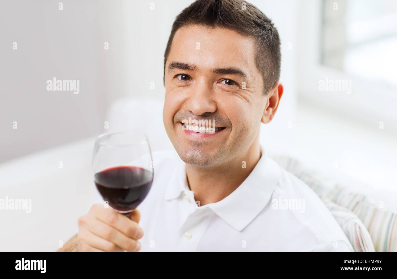 happy man drinking red wine from glass at home Stock Photo - Alamy