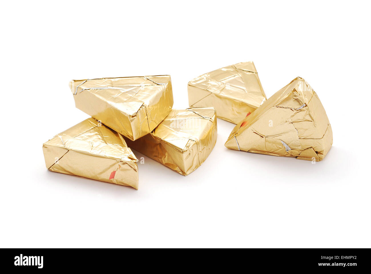 cheese triangle in foil on white Stock Photo Alamy