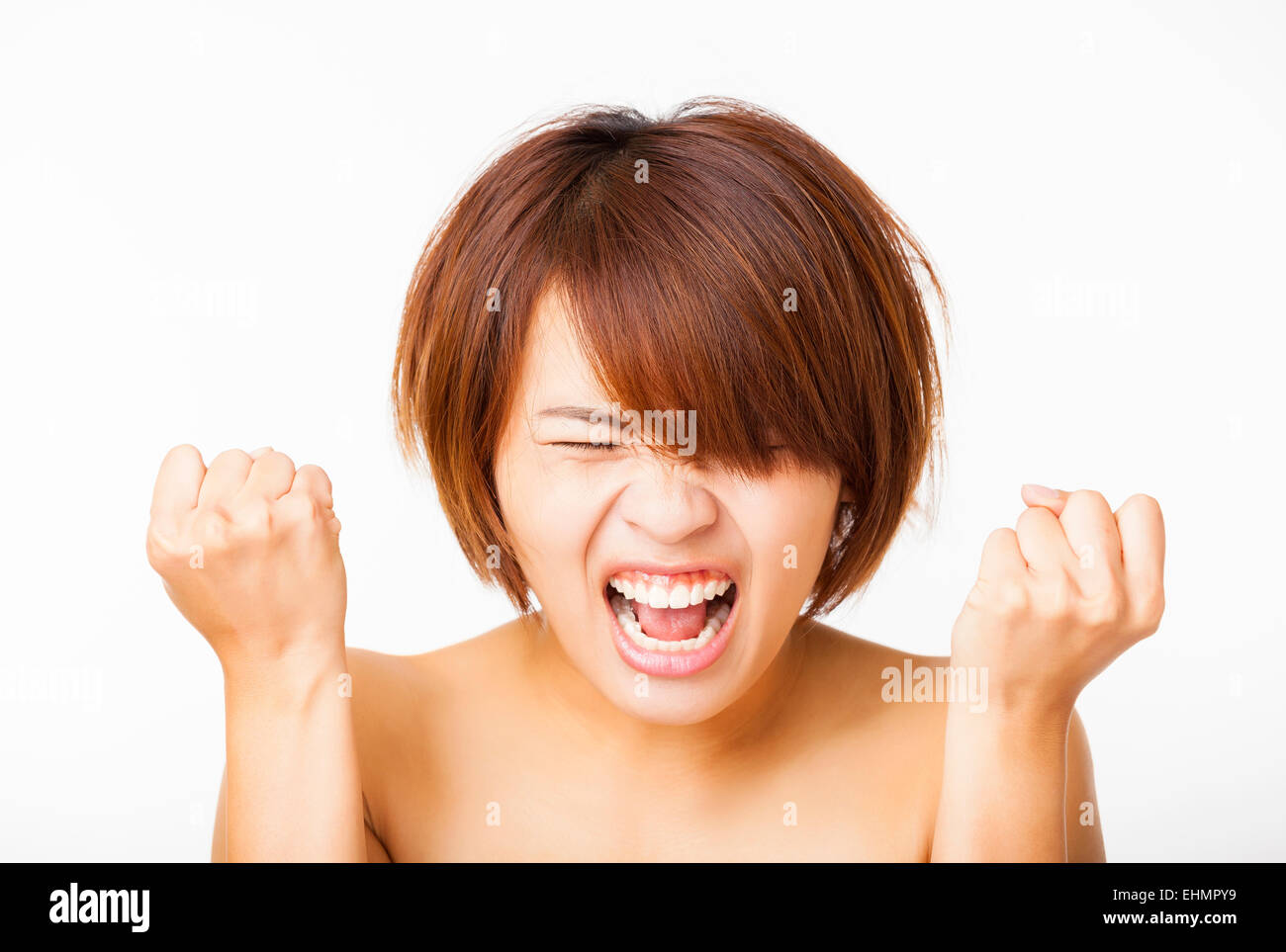 Closeup angry young woman and yelling screaming Stock Photo