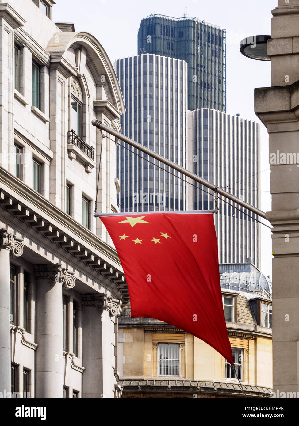 The Chinese flag hangs from offices of the Bank of China in the City of London. China in London. Stock Photo