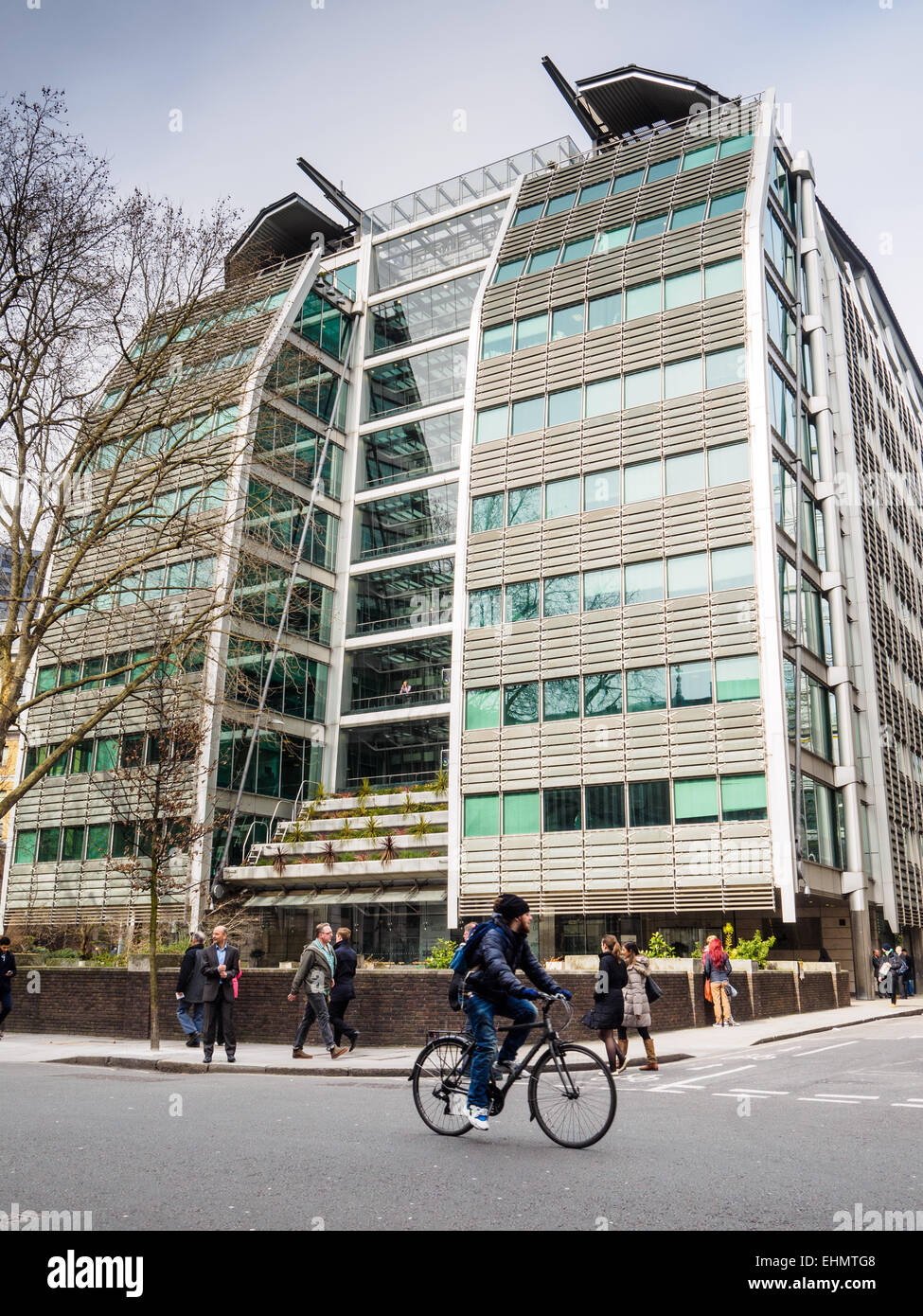 Lloyds Banking Group Headquarters. A cyclist and pedestrians pass the Lloyds Banking Group HQ in Gresham Street Central London Stock Photo