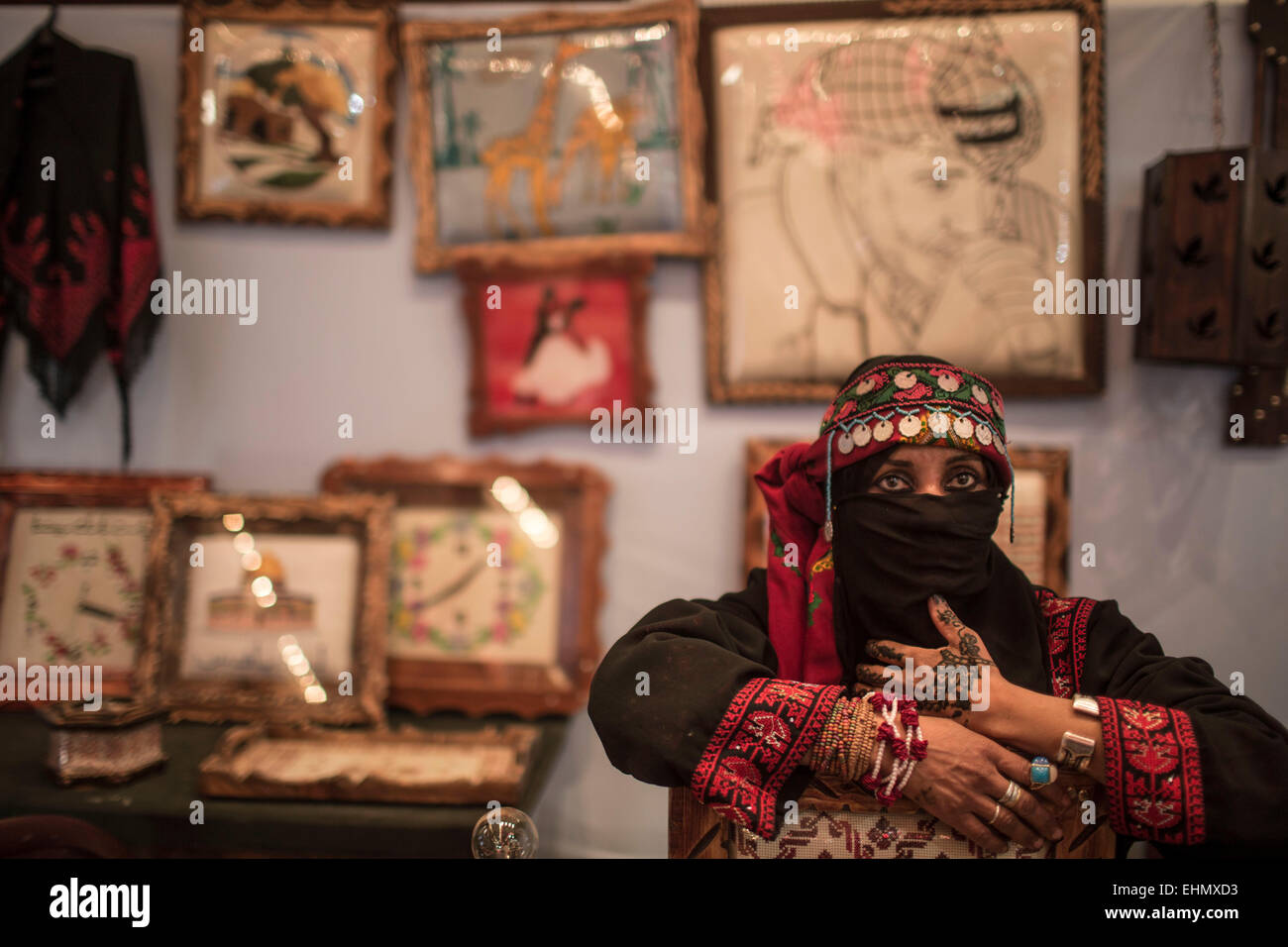Gaza. 16th March, 2015. A Palestinian woman attends 'Our product' exhibition in Gaza City on March 16, 2015. The exhibition displays Palestinian fashion for women, most of which are designed in Gaza. Credit:  Xinhua/Alamy Live News Stock Photo