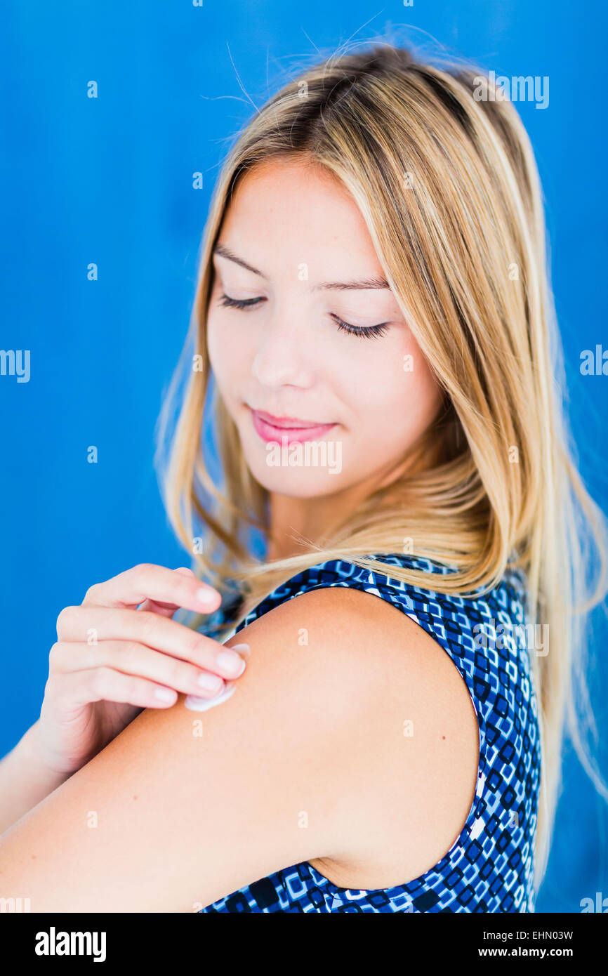 Skincare, Woman applying body cream. Stock Photo
