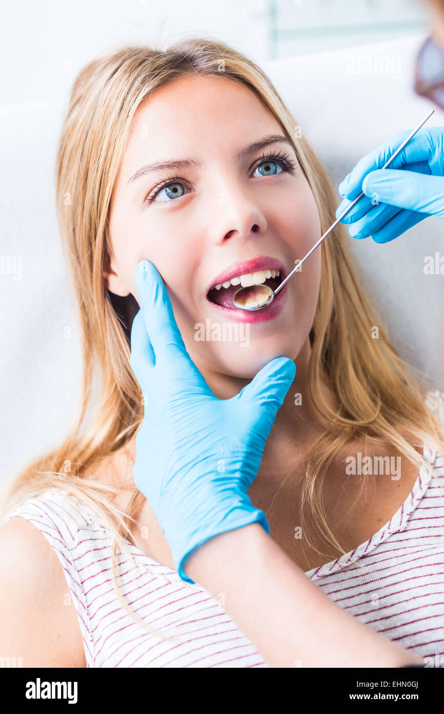 Woman getting dental examination at the dentist. Stock Photo