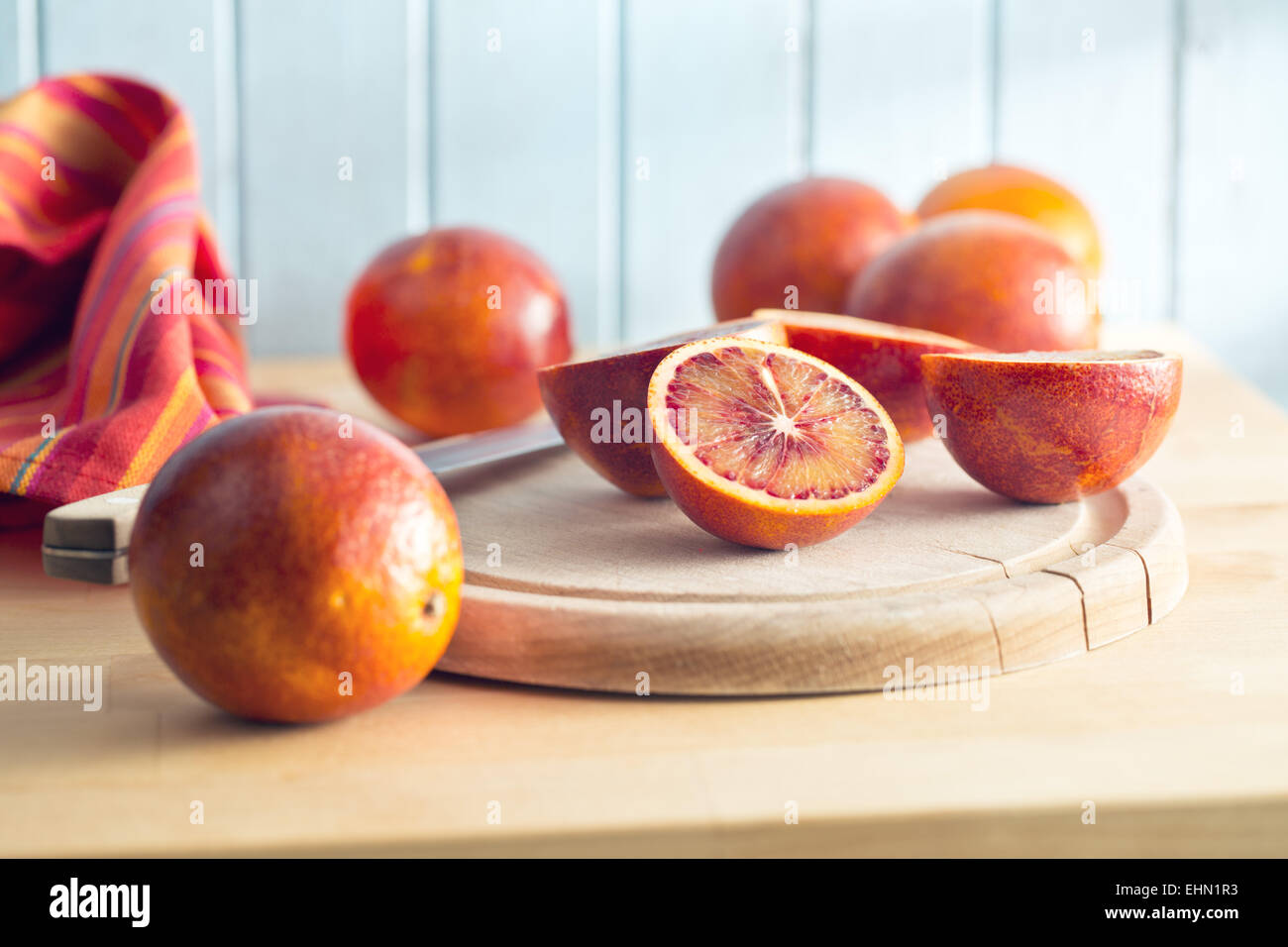 halved blood orange on kitchen table Stock Photo
