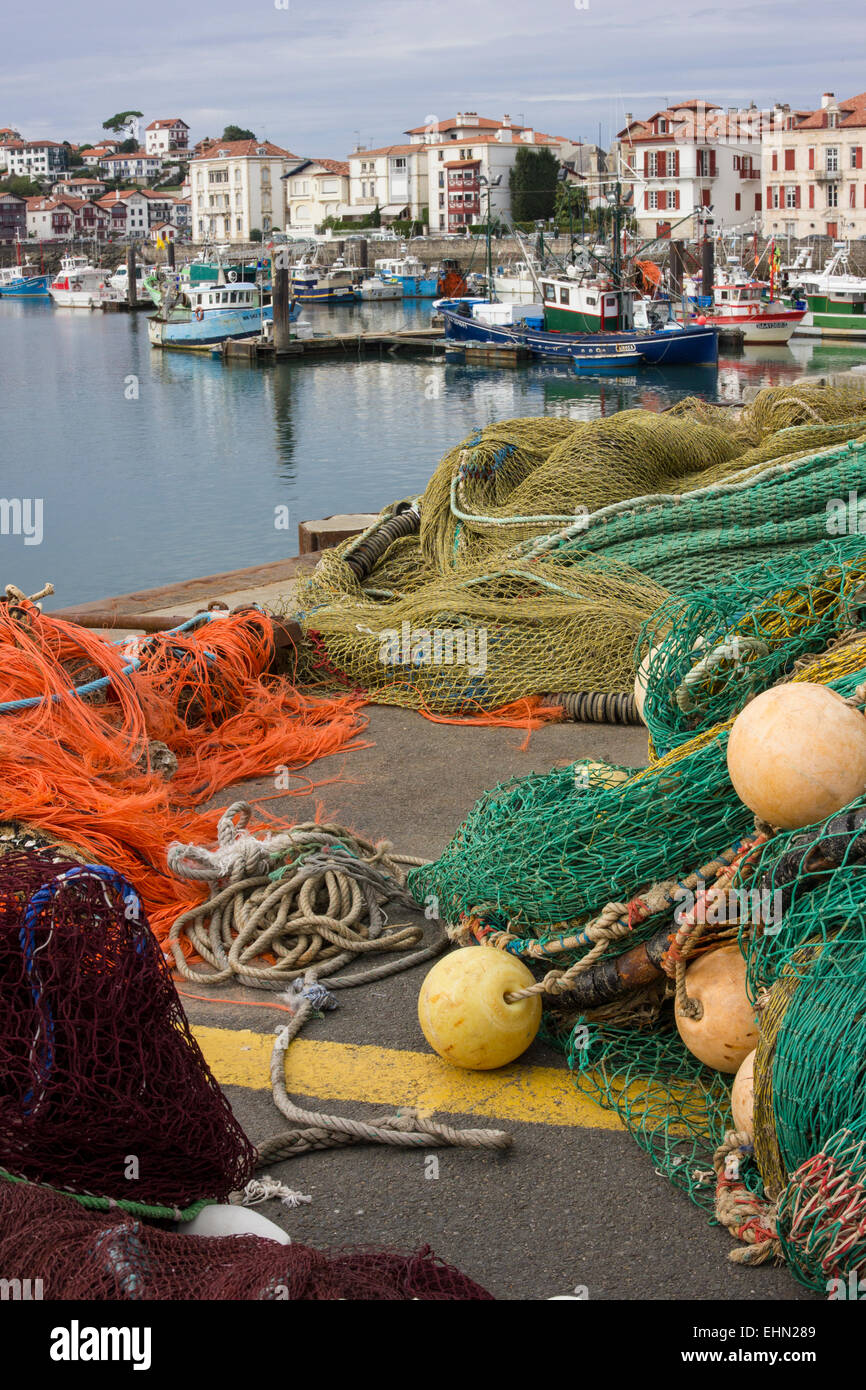 Fishing boats and nets, port of St Jean de Luz, Southern France Stock Photo