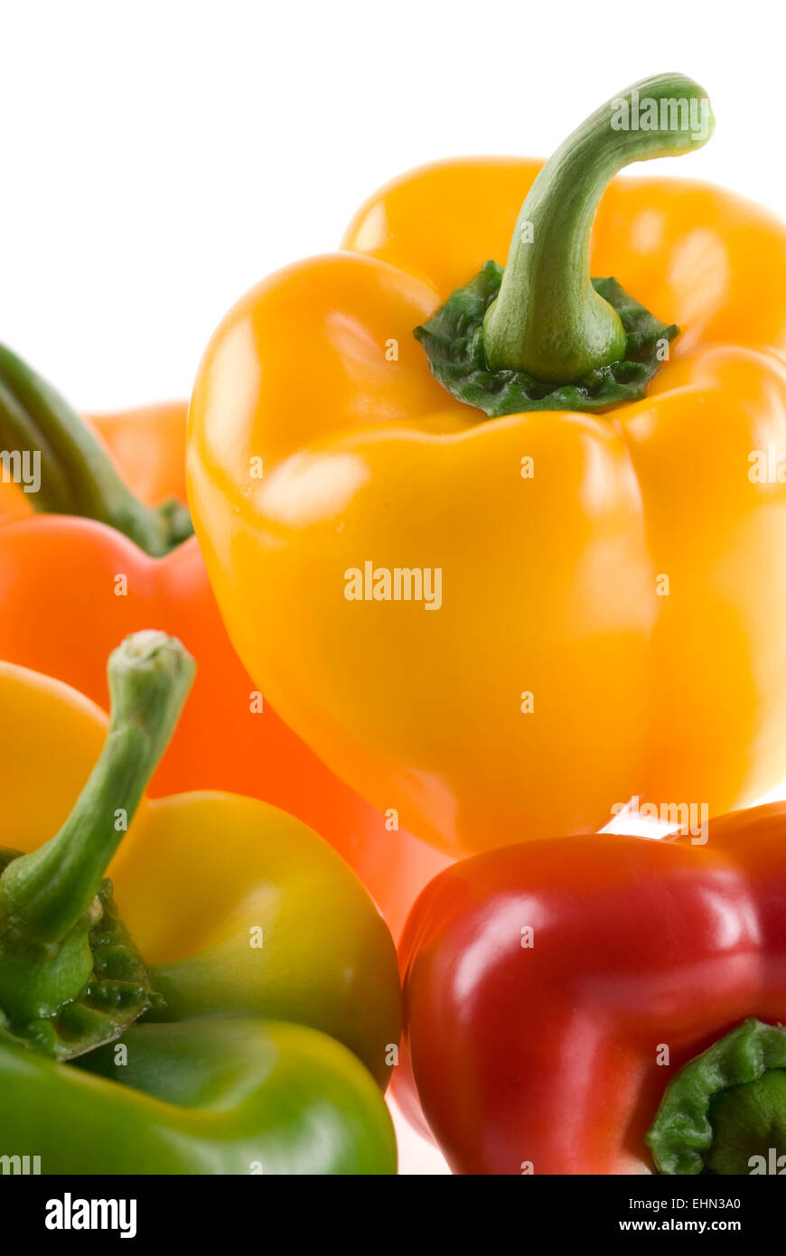 Yellow, red, green and orange bell peppers. Stock Photo