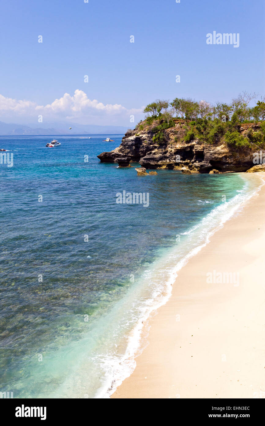 Sandy ocean coast and rocks. Bali. Indonesia Stock Photo