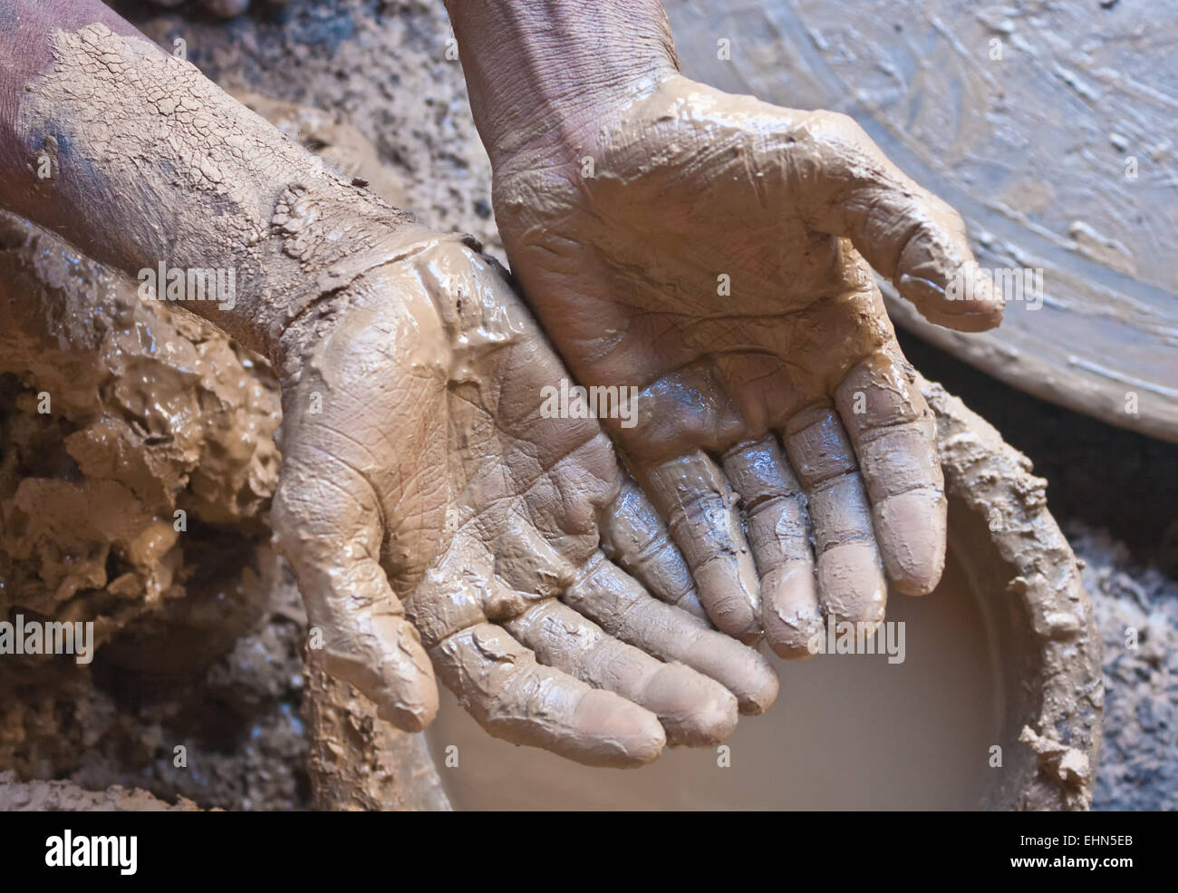Closeup of craftsman's muddy hands Stock Photo Alamy