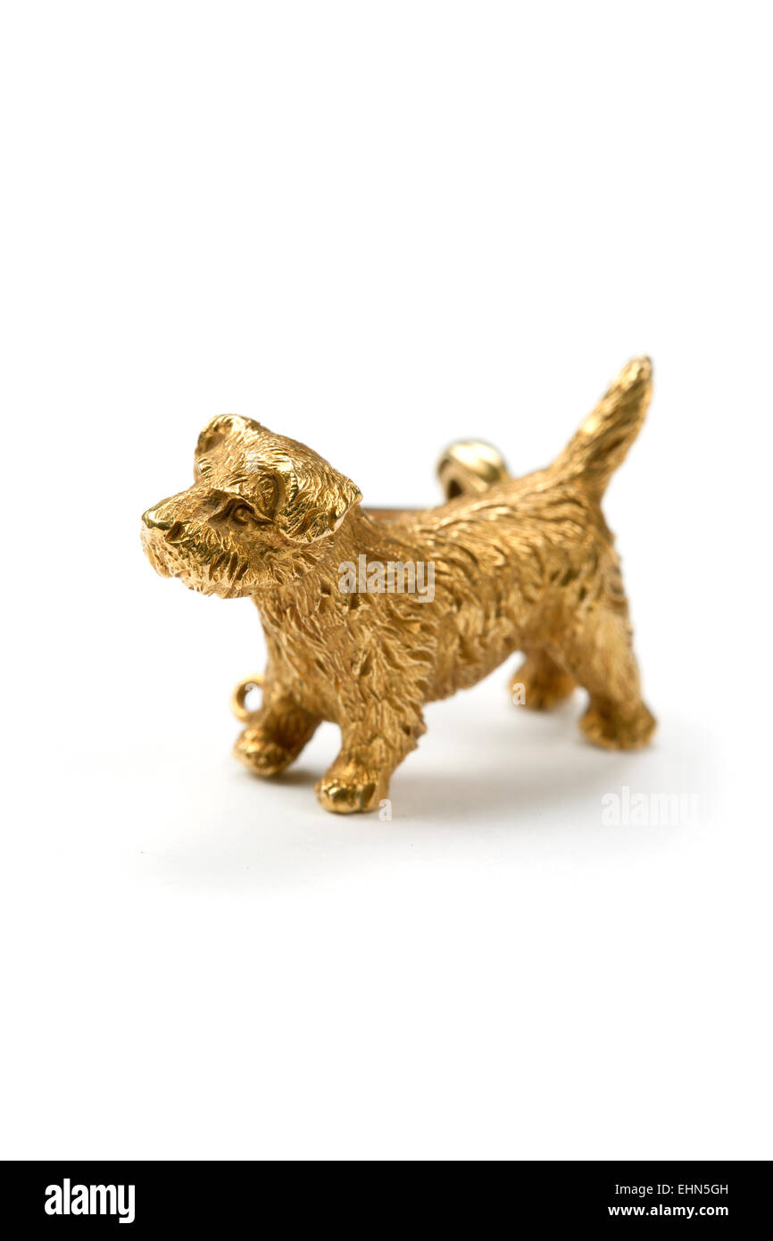 Gold terrier dog brooch. Stock Photo