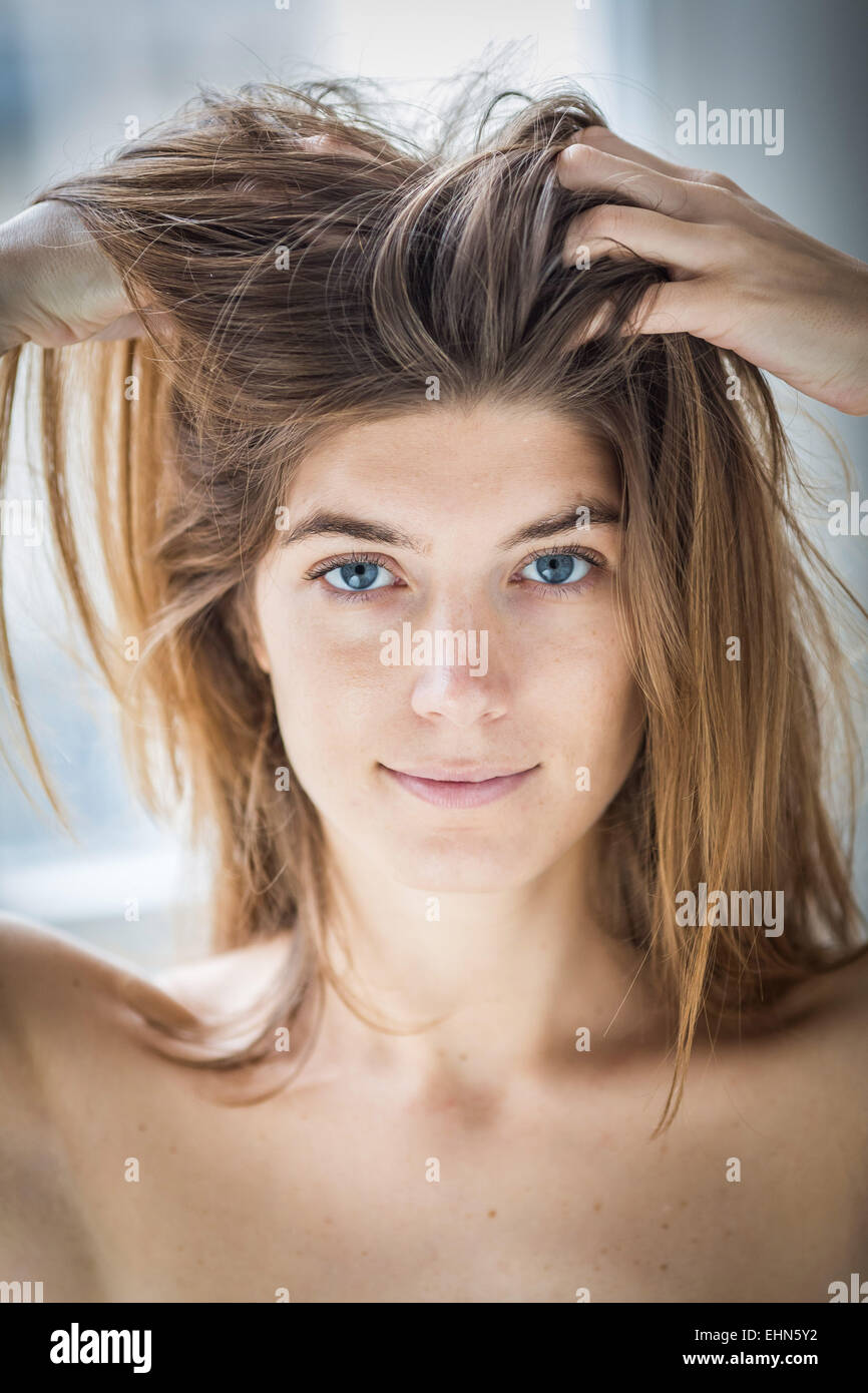 Woman massaging her scalp. Stock Photo