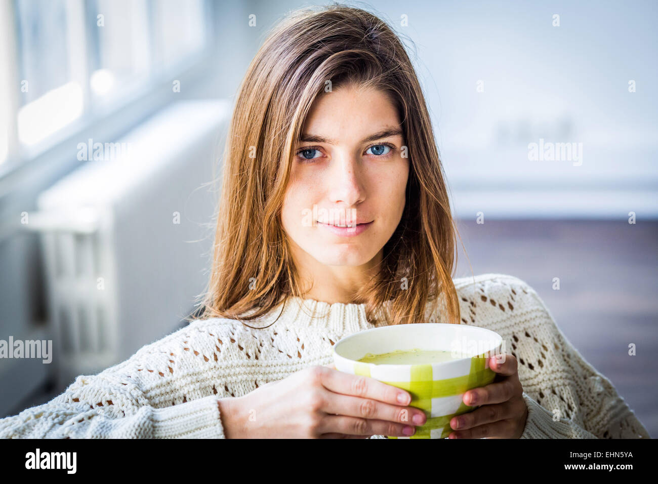 Woman eating a soup. Stock Photo
