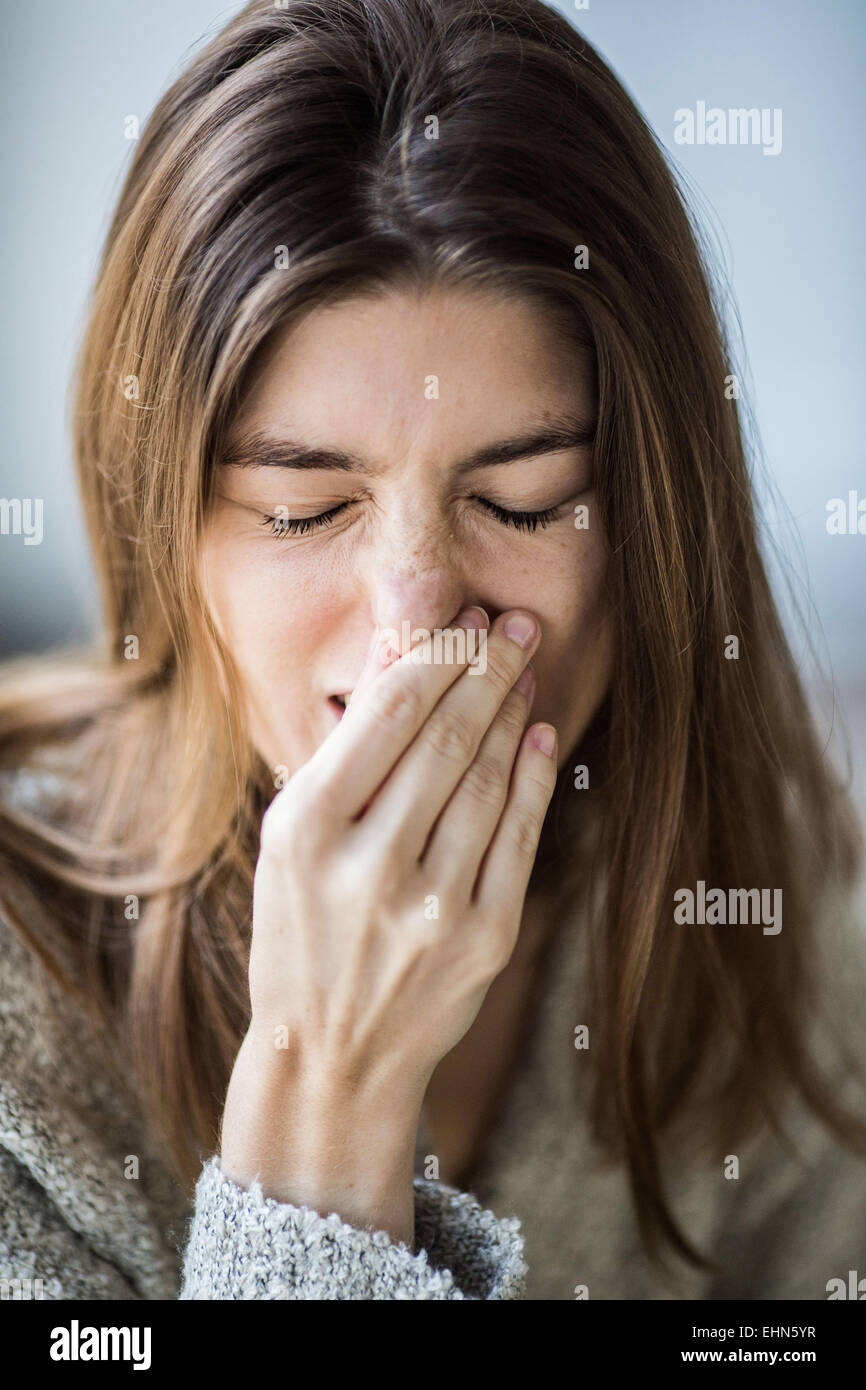 Woman sneezing. Stock Photo