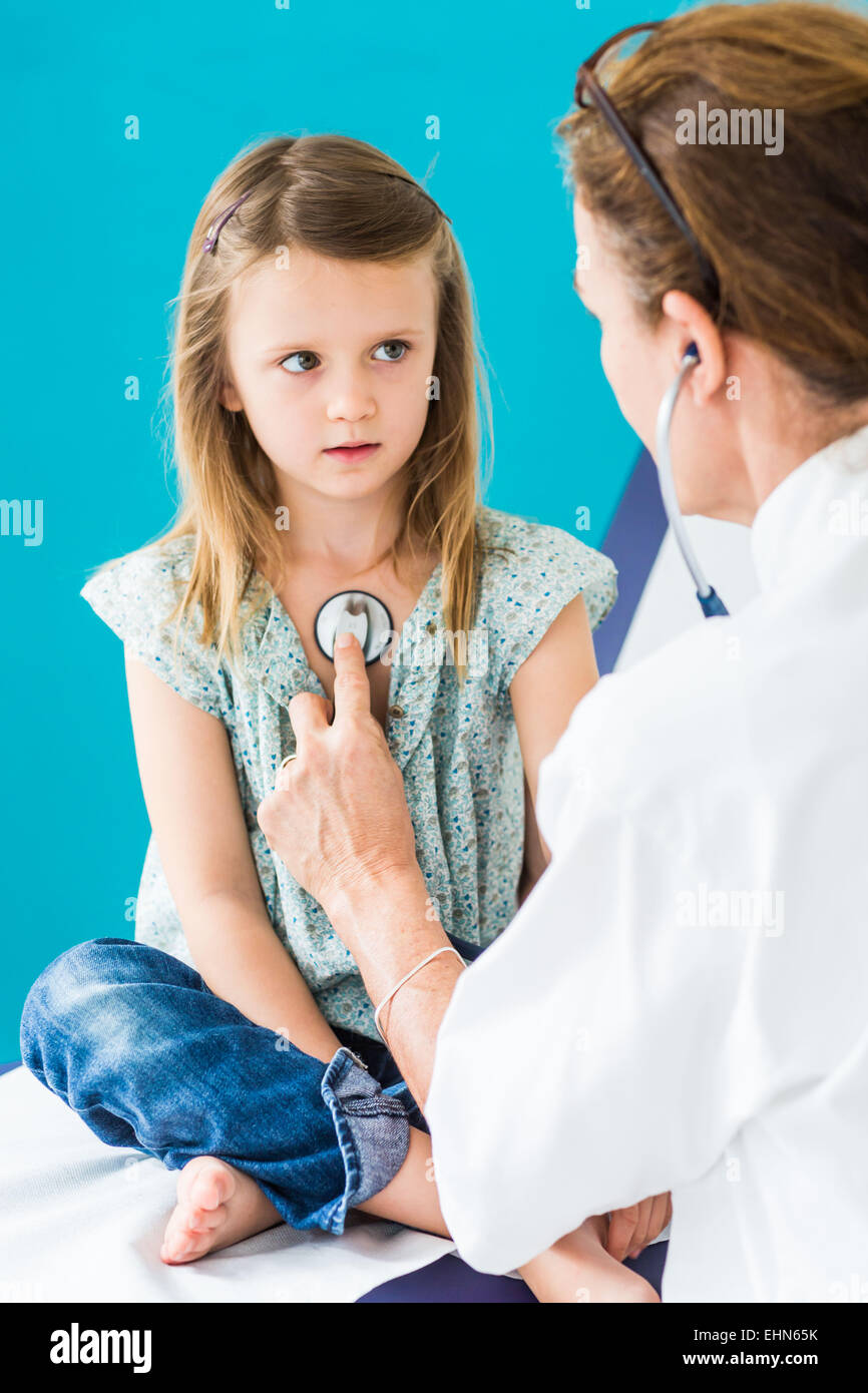 Doctor examining a 5 year old girl with a stethoscope Stock Photo Alamy