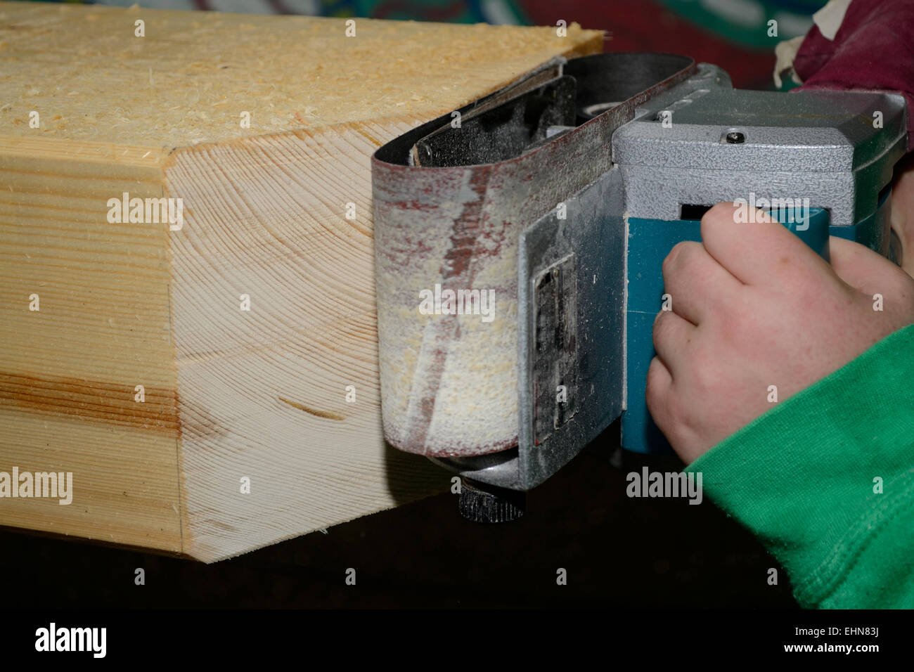 Belt sander in use Stock Photo Alamy