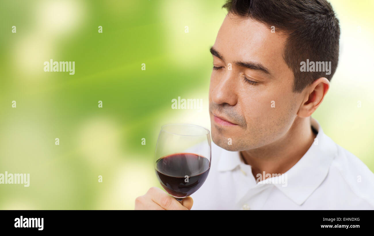 happy man drinking red wine from glass Stock Photo - Alamy